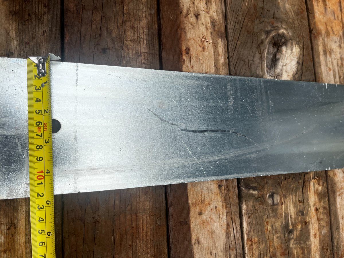Tape measure across the base connector plate showing a 5 inch width